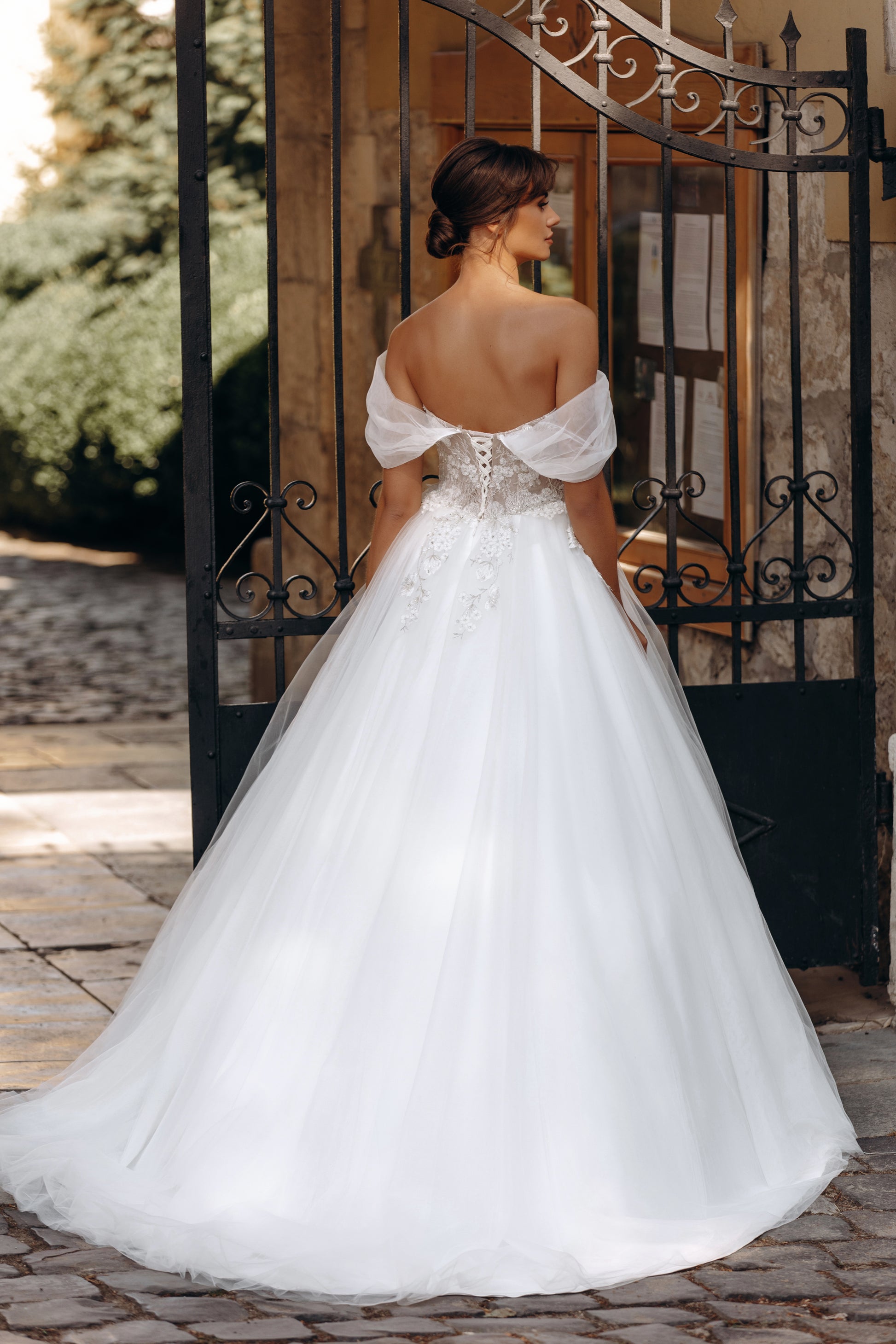Off-shoulder ball gown with low back and floral embroidery