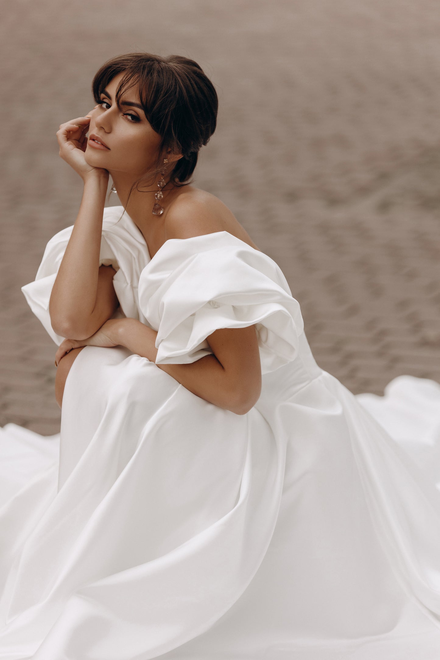Bride showcasing puff sleeve detail and sweetheart neckline