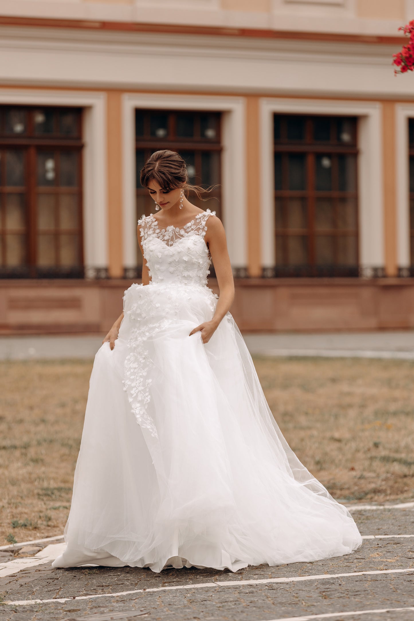Bride in ball gown showcasing the low back and soft train