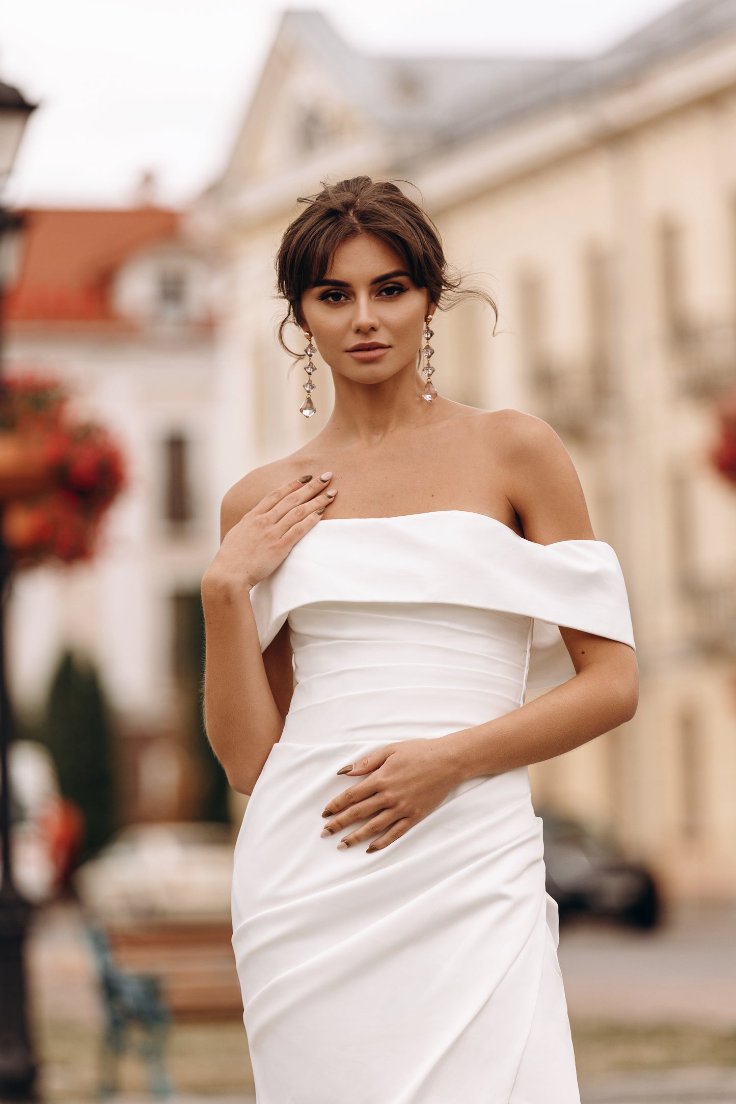 Puff sleeve and neckline details on fitted ivory gown
