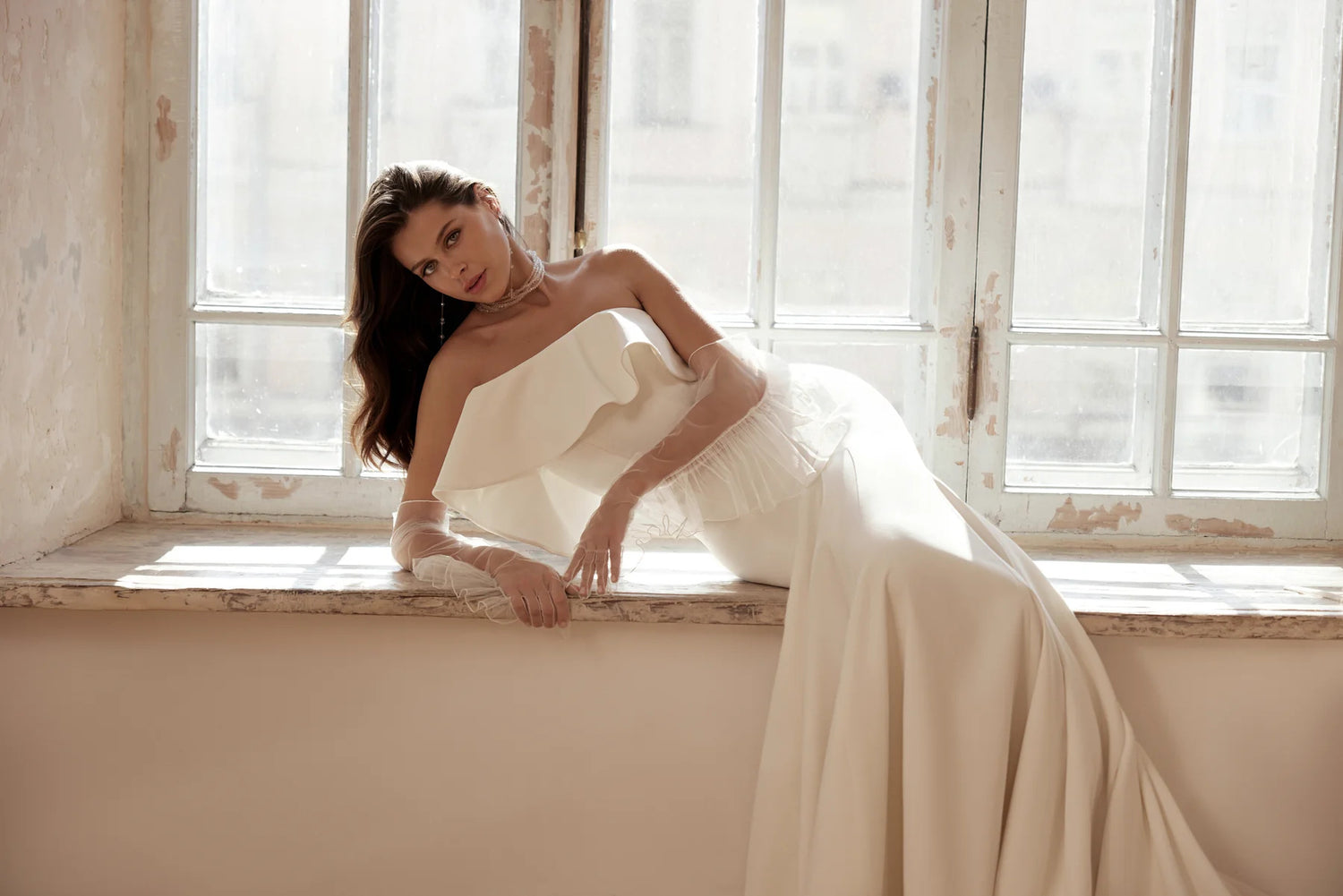 Lightweight wedding dress with ruffle detail and flowing silhouette