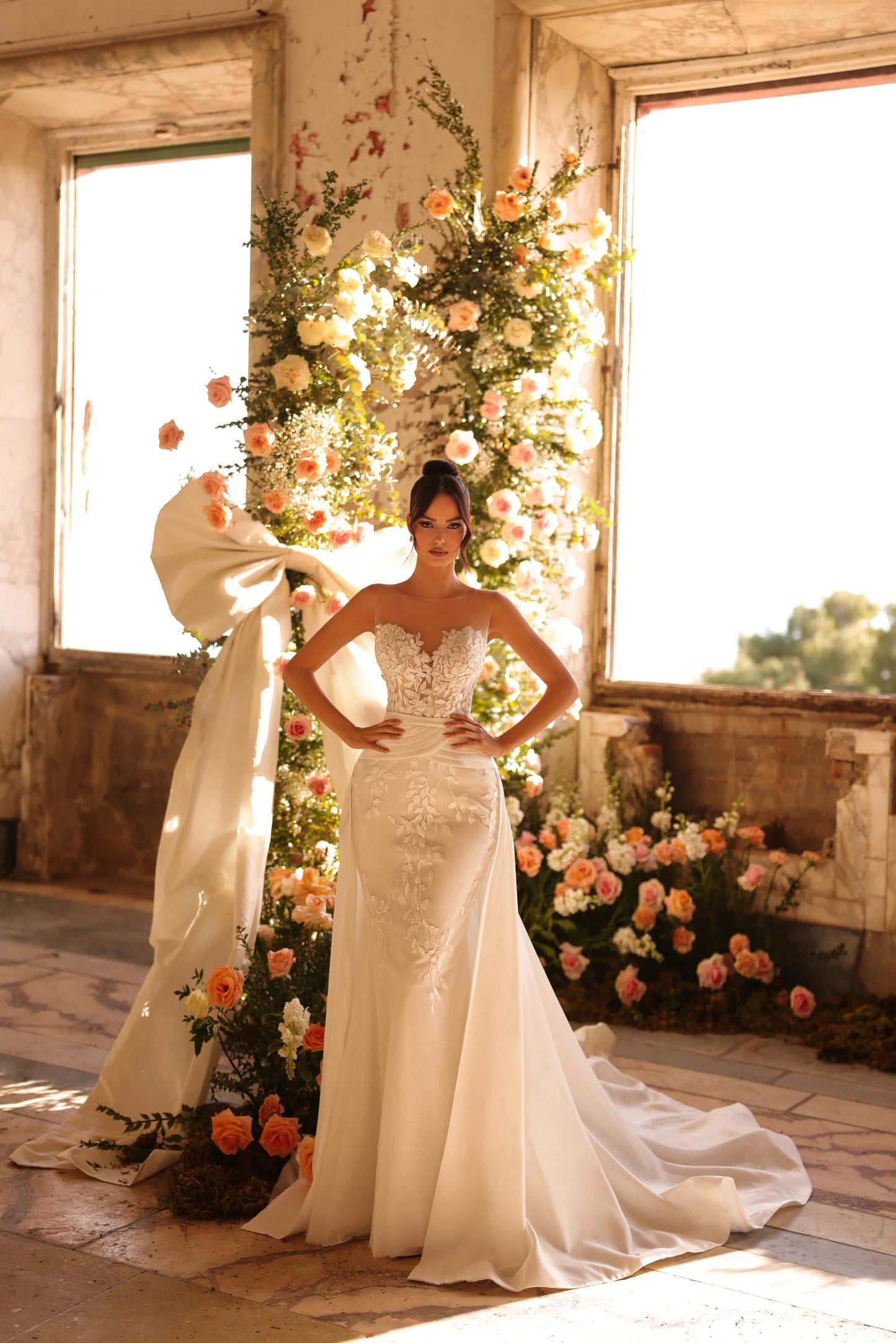 Romantic wedding dress with soft floral detailing and fitted structure