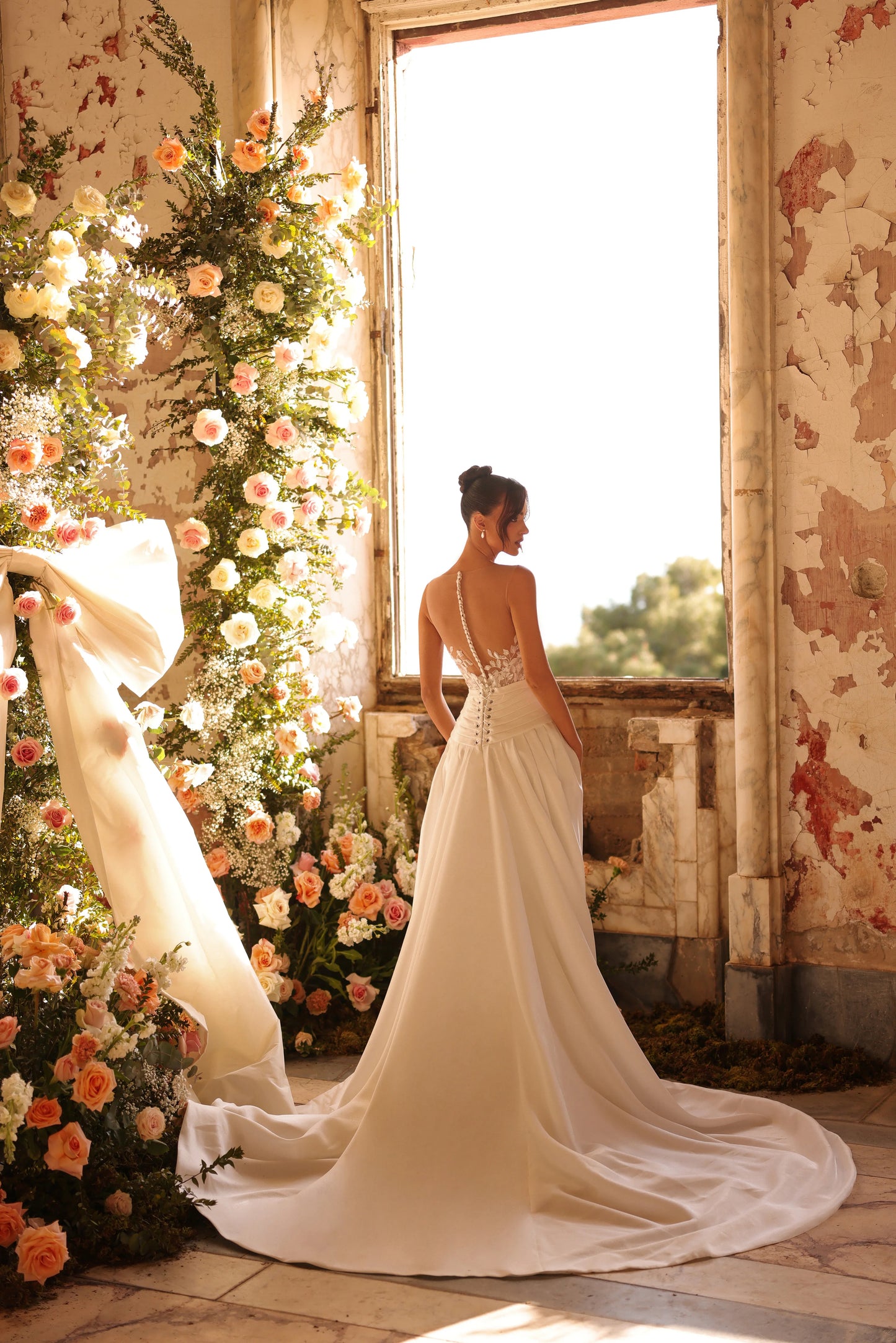 Flowing overskirt and sculpted silhouette for a stunning walk-away moment