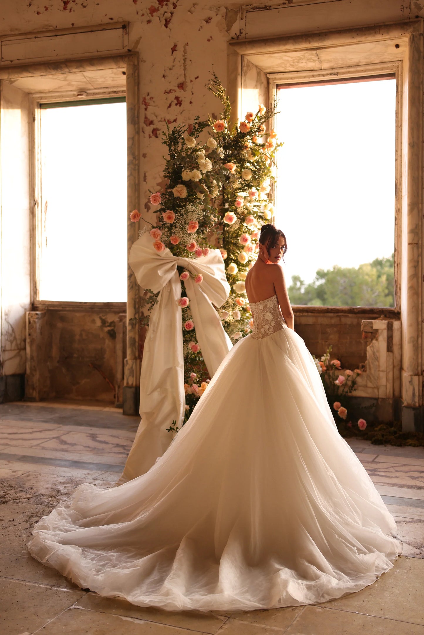 Classic bridal train flowing from delicately embroidered bodice