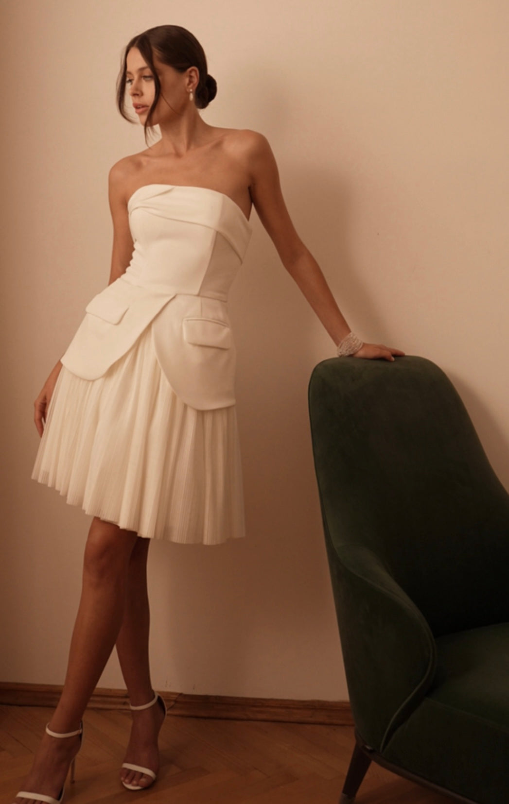 Detailed look at the strapless neckline and pocket feature of the minimalist wedding dress
