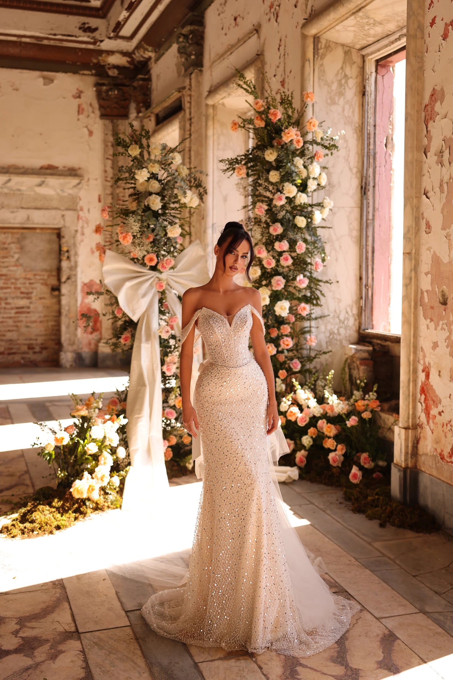 Bride in shimmering beaded wedding gown with sculpted silhouette and bold presence