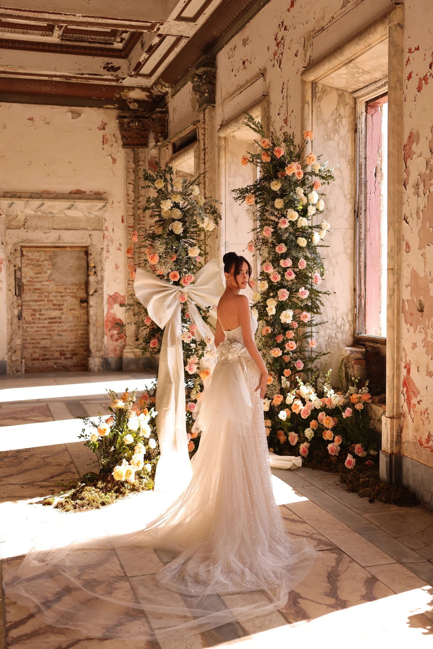 Statement wedding gown featuring back beading and show-stopping tulle bow