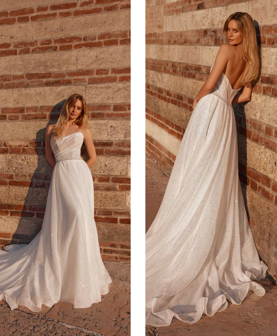 Bride in strapless wedding gown with fitted bodice and flowing skirt