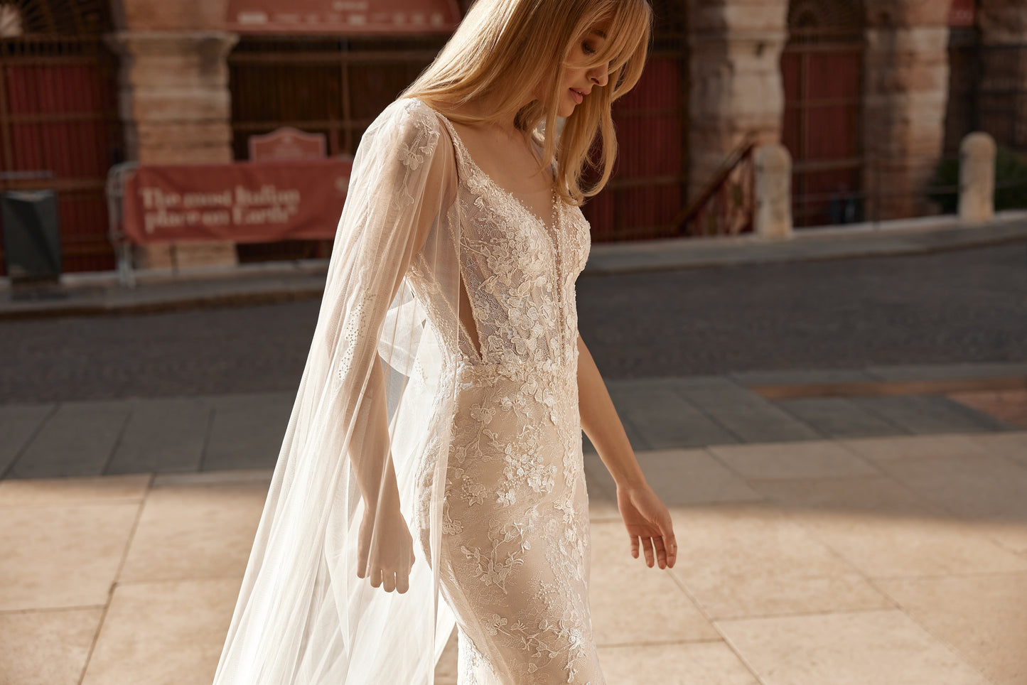 Romantic wedding dress with flowing tulle train and delicate lace details