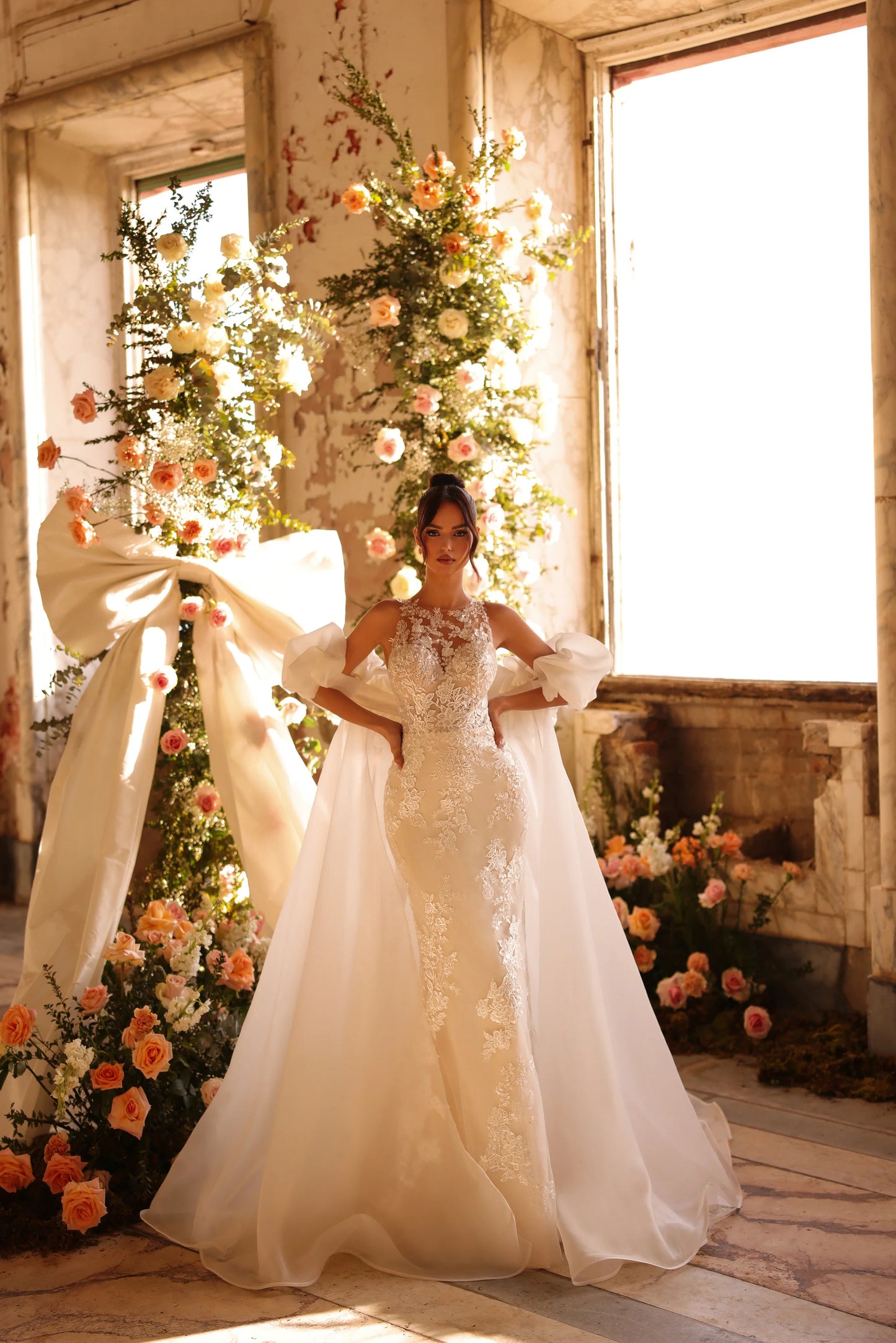 Bride in elegant wedding dress with floral neckline and sculpted lace bodice
