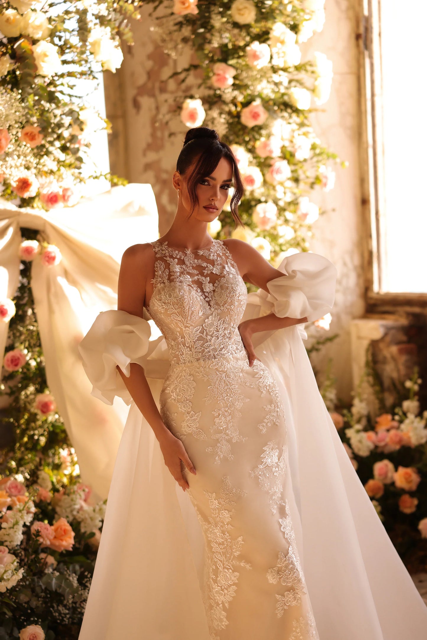 Statement wedding dress with regal silhouette and timeless lace accents