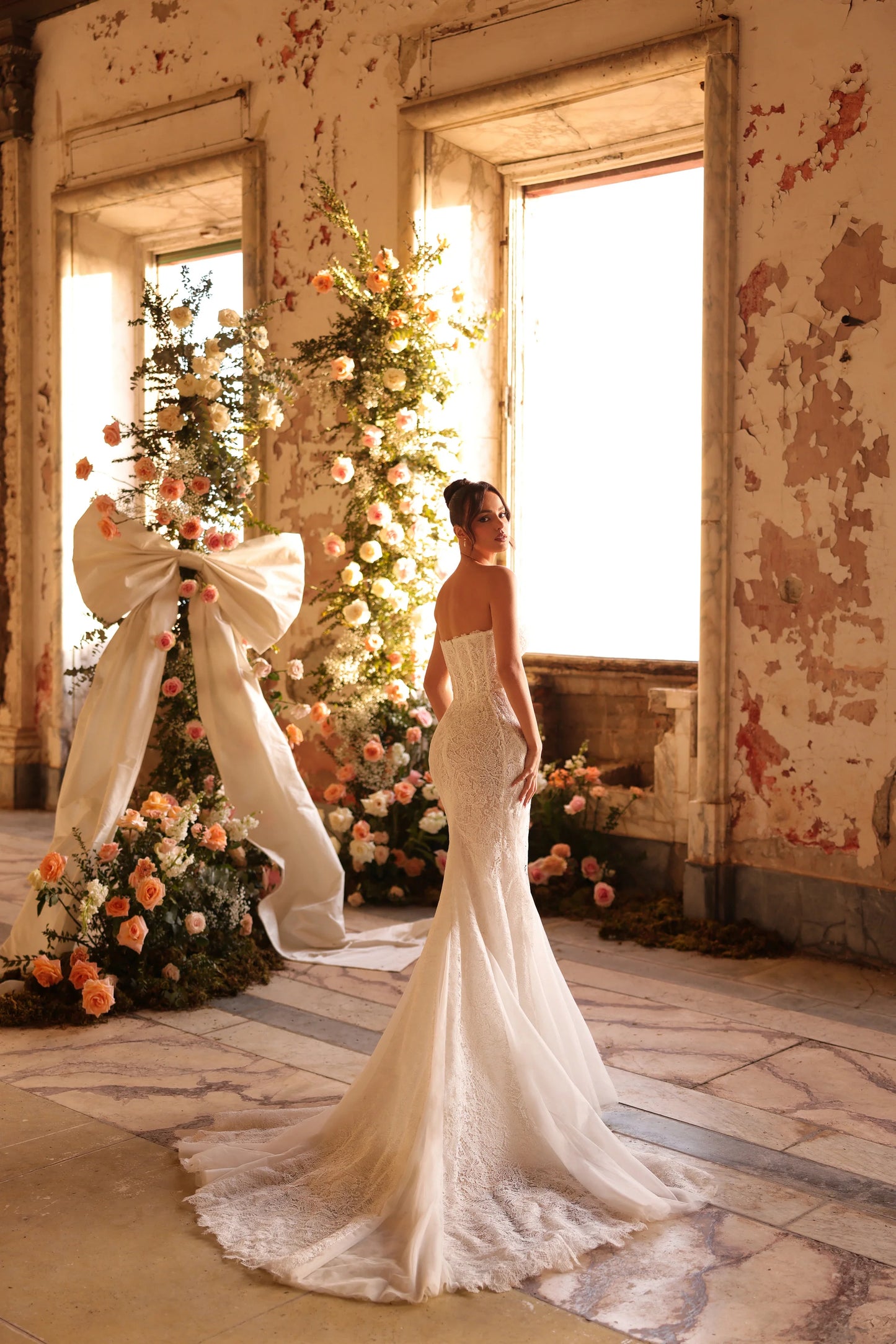 Elegant bridal gown with clean design and striking detachable bolero piece