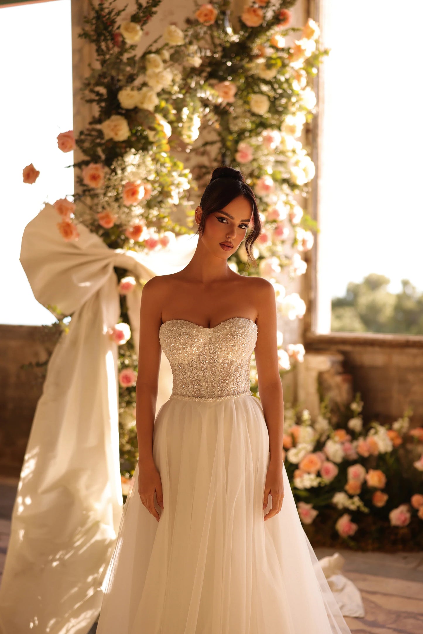 Elegant off-shoulder wedding dress with shimmer bodice and full tulle silhouette