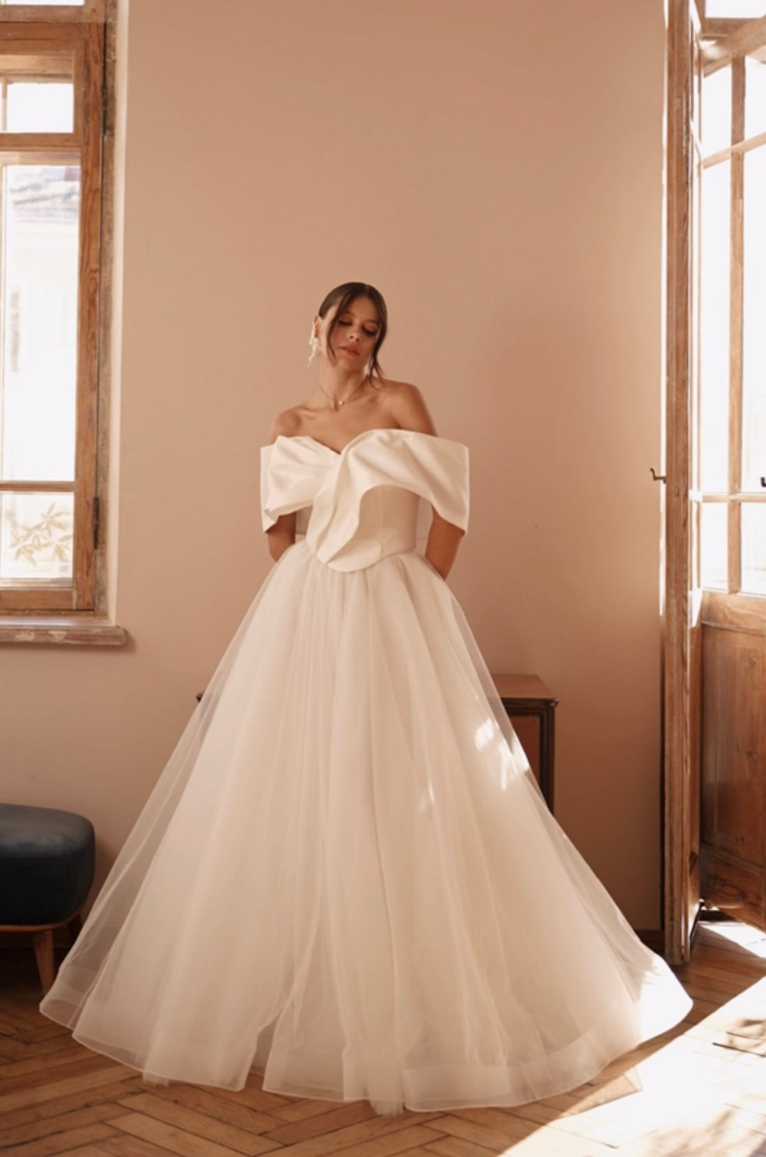 Bride showcasing off-shoulder neckline and voluminous top