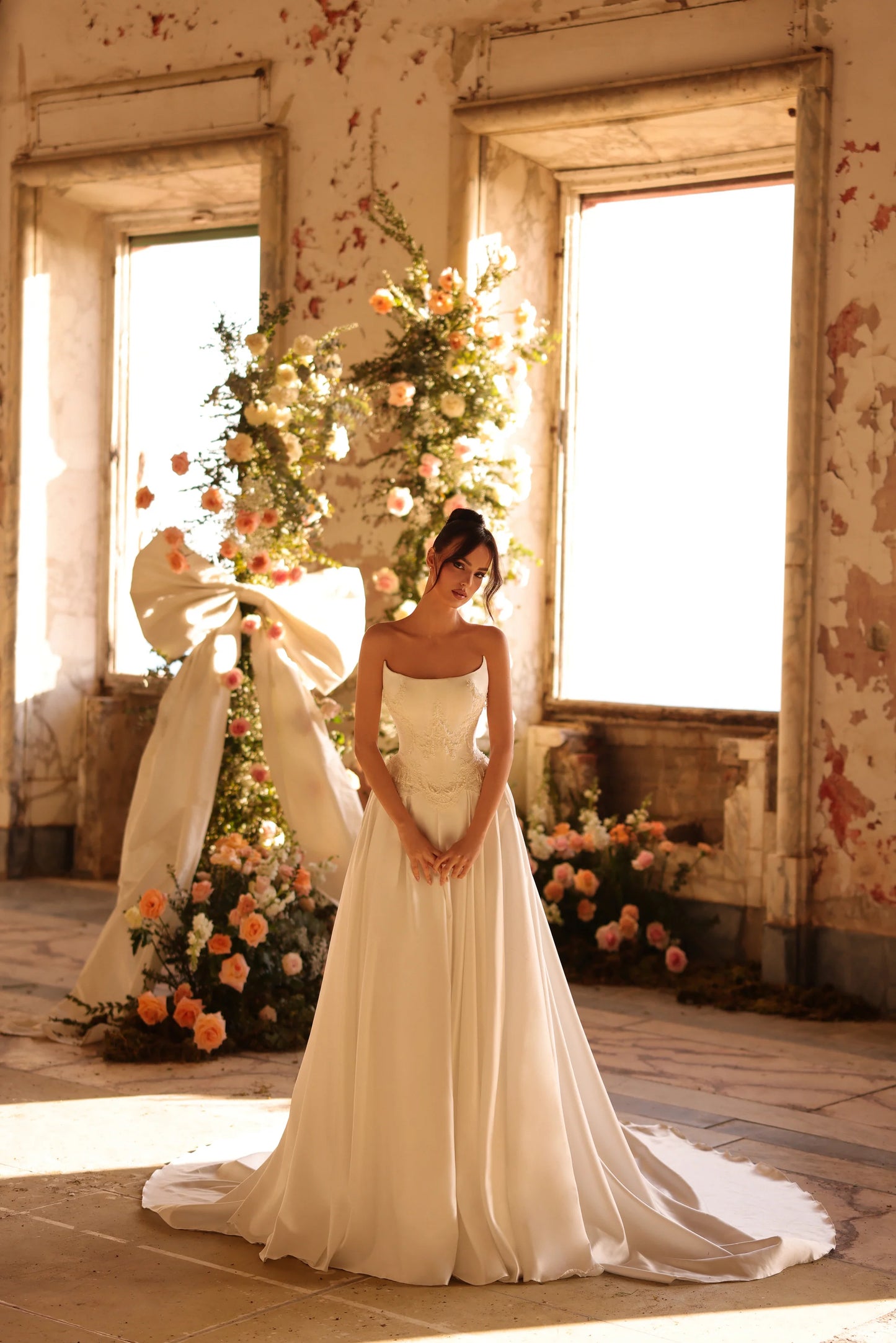 Close-up of the gown's structured bodice with delicate lace details and dreamy texture.