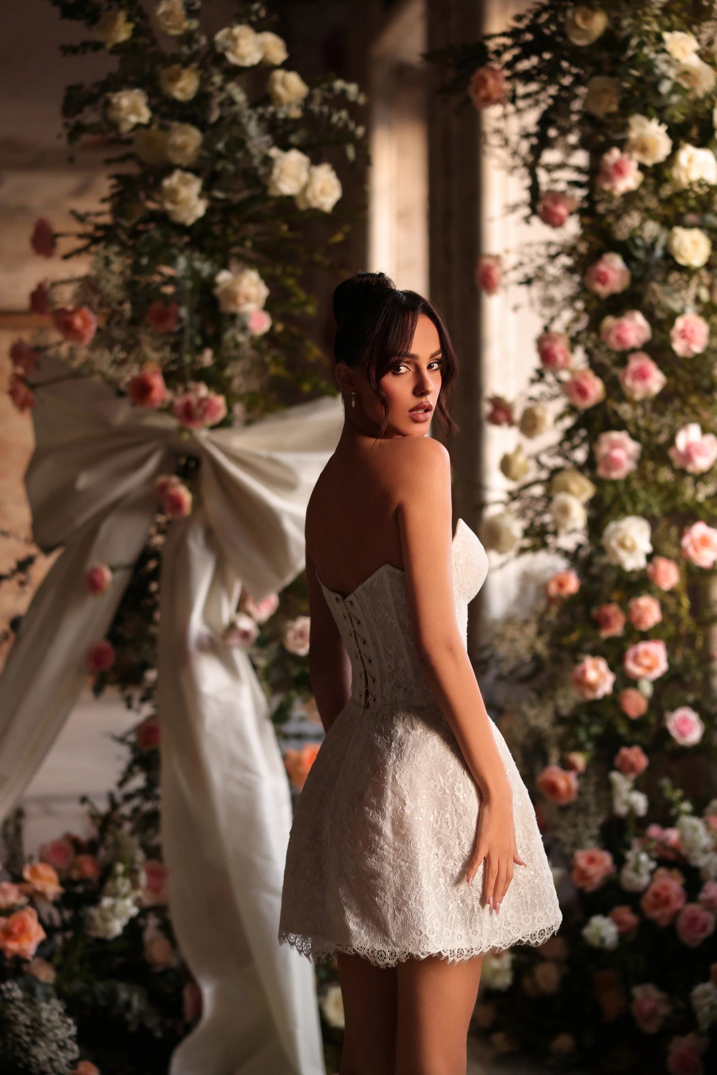 Chic mini bridal gown with bow detail and modern silhouette