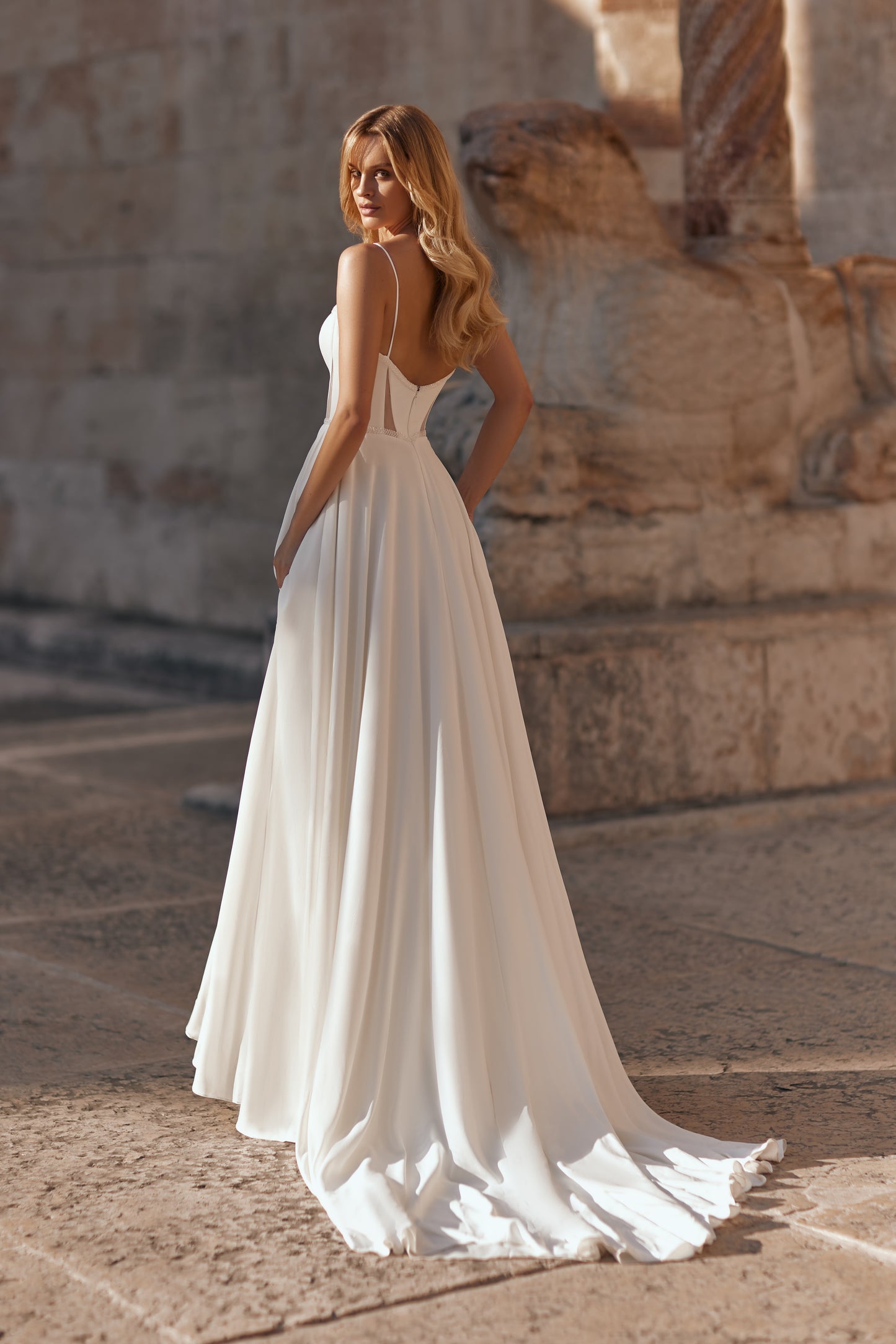 Full-length view of the Juliet gown with delicate straps and a flowing A-line silhouette.