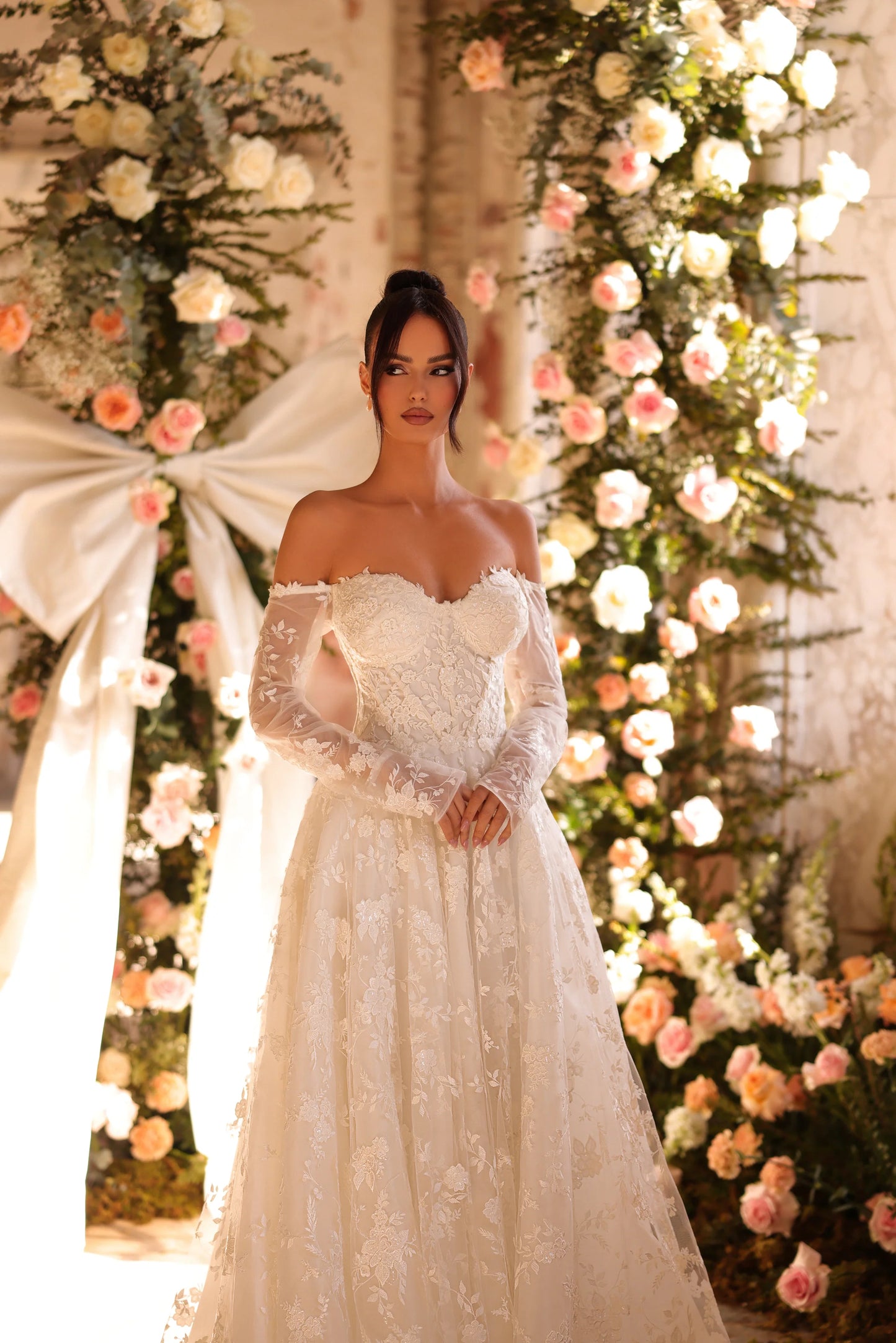 Delicate floral lace detailing on off-the-shoulder wedding dress