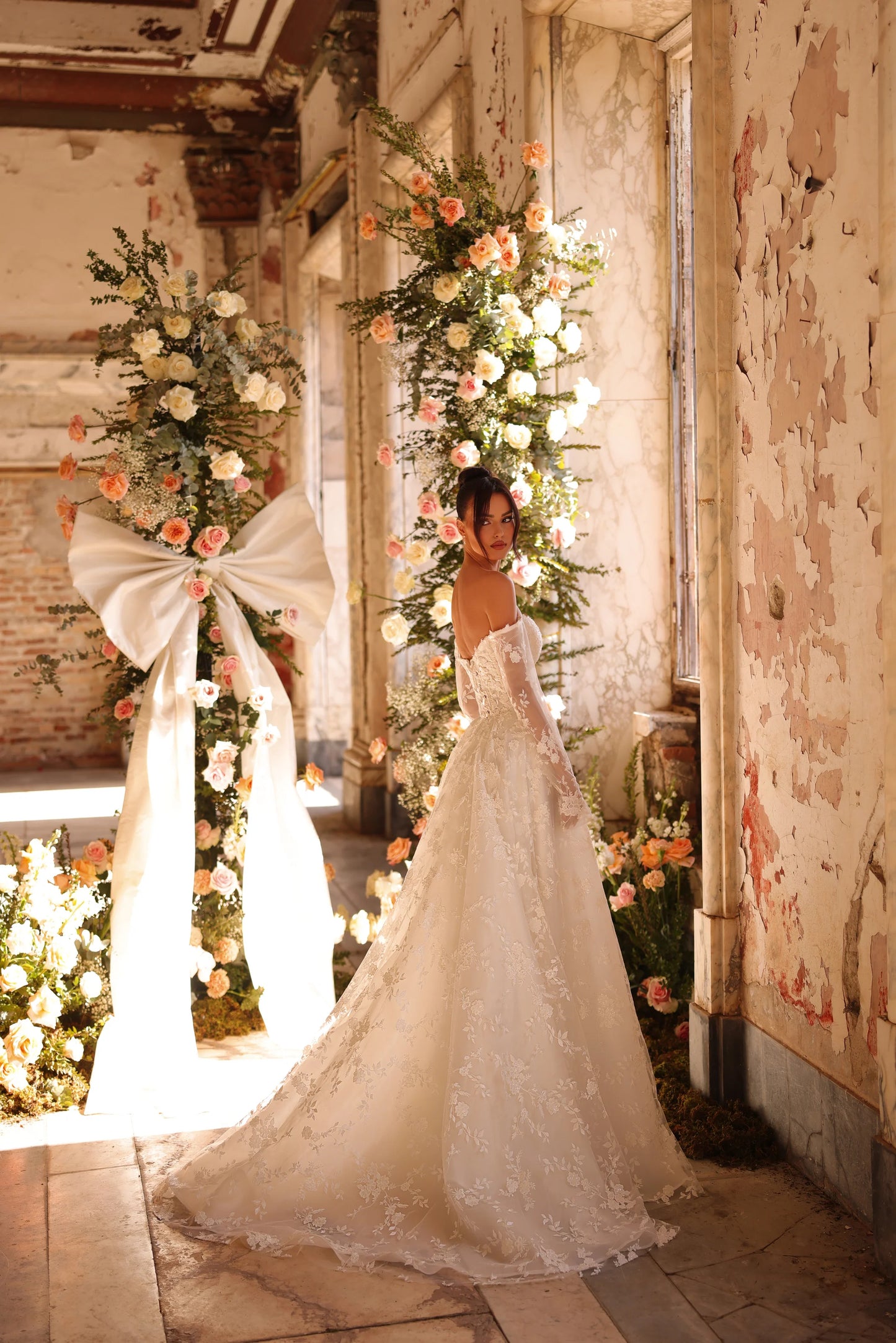 Elegant lace bridal gown with fitted bodice and flowing train
