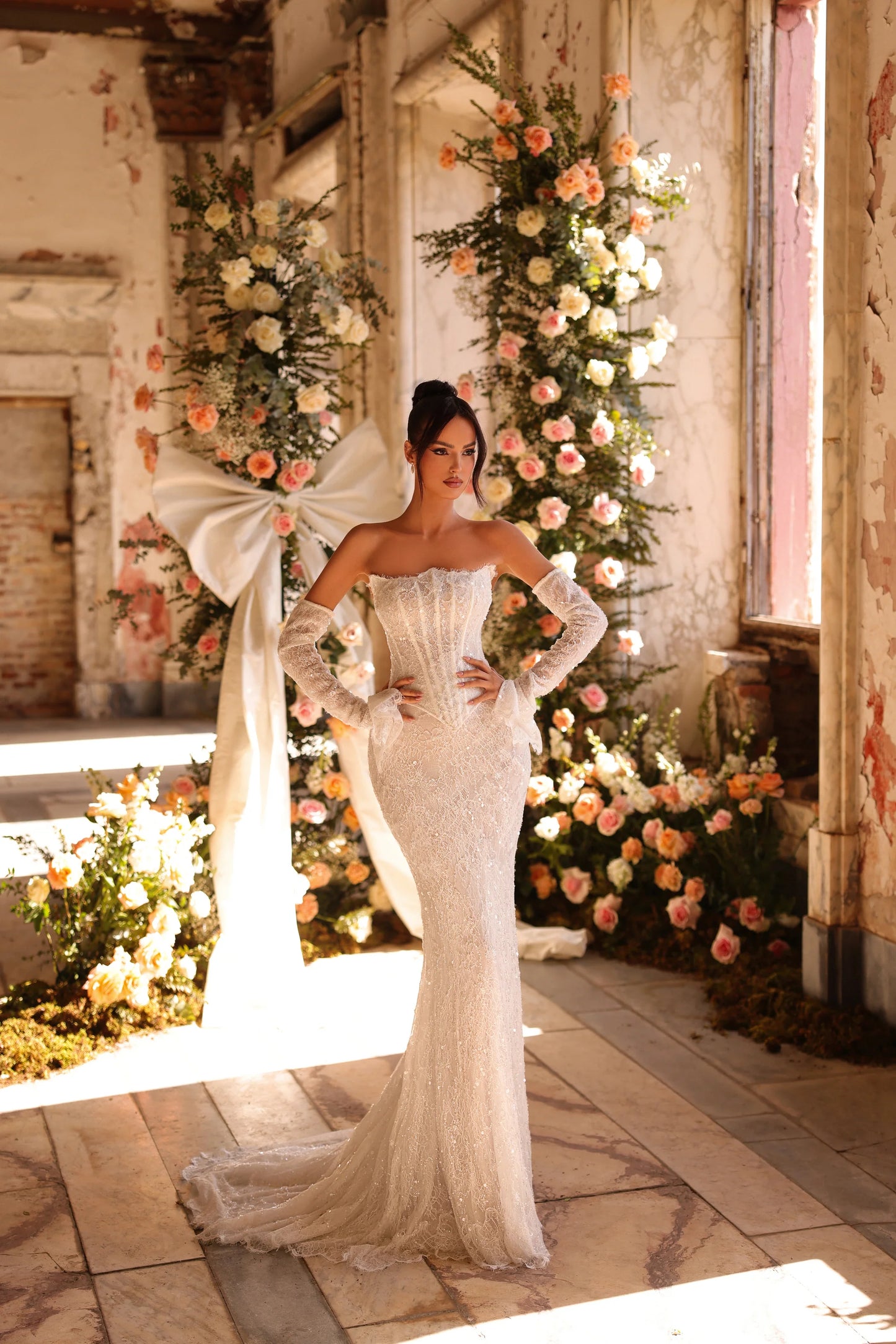 Wedding dress with fitted lace silhouette and dramatic train