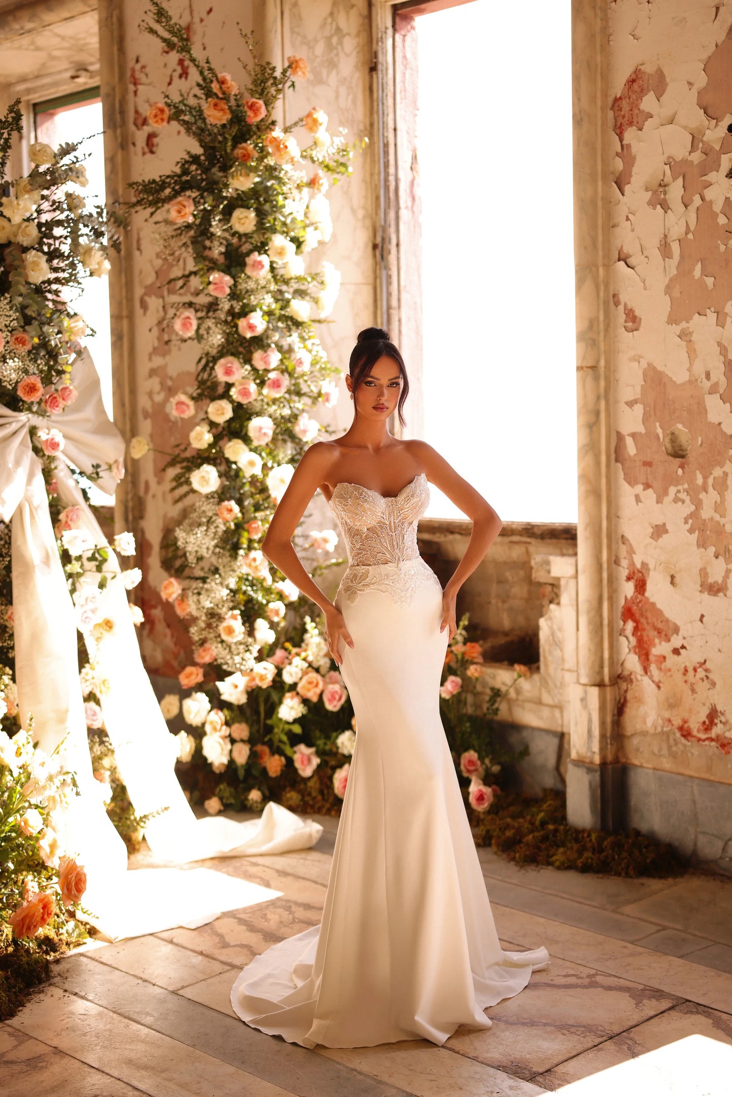 Modern fitted wedding dress with feminine structure and glowing details