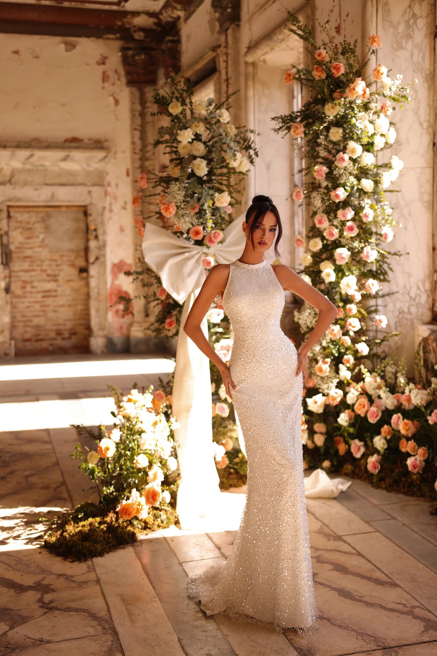 Wedding dress with sculptural tulle ruffles and soft train detail