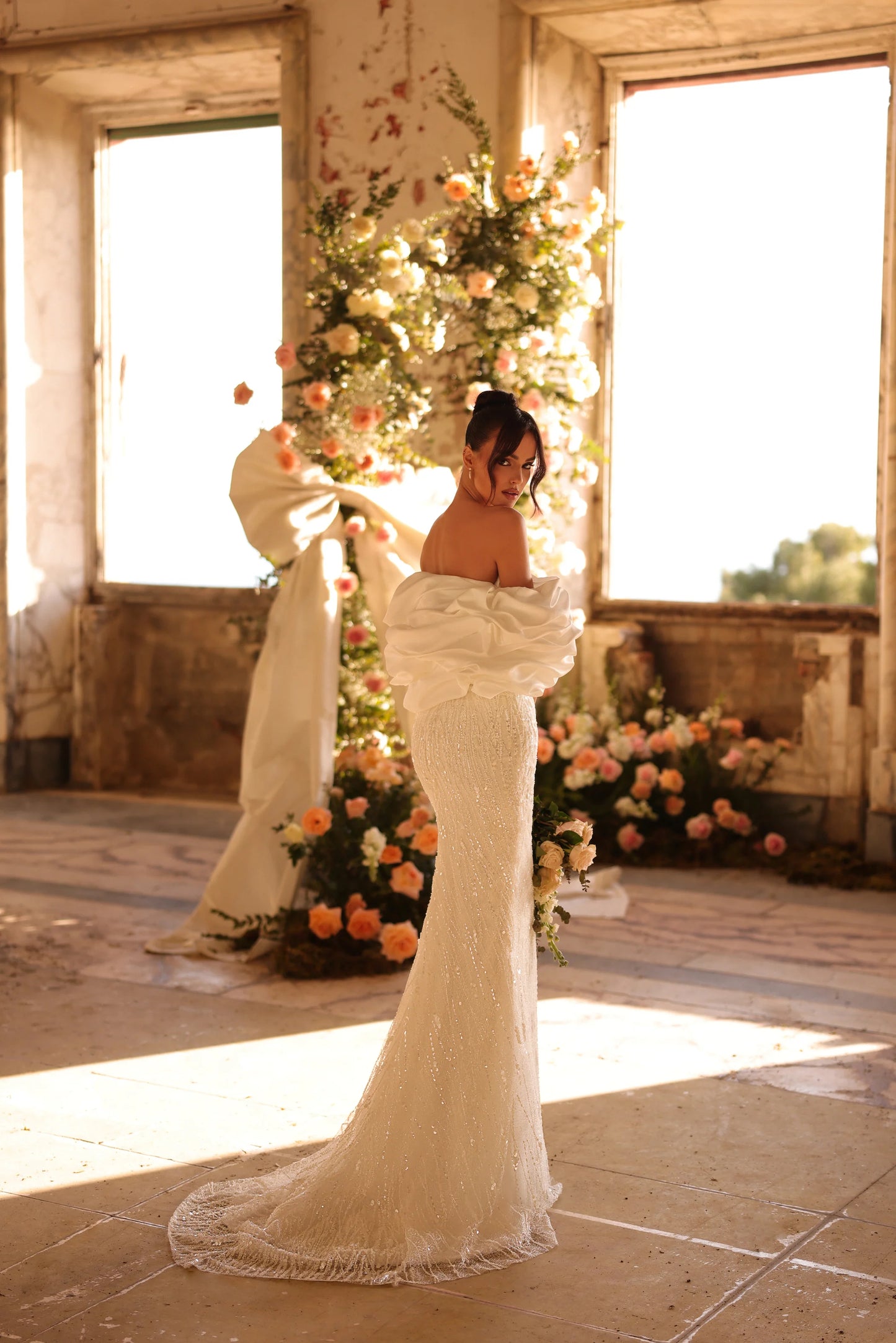 Wedding dress with soft shimmer and romantic silhouette in floral setting