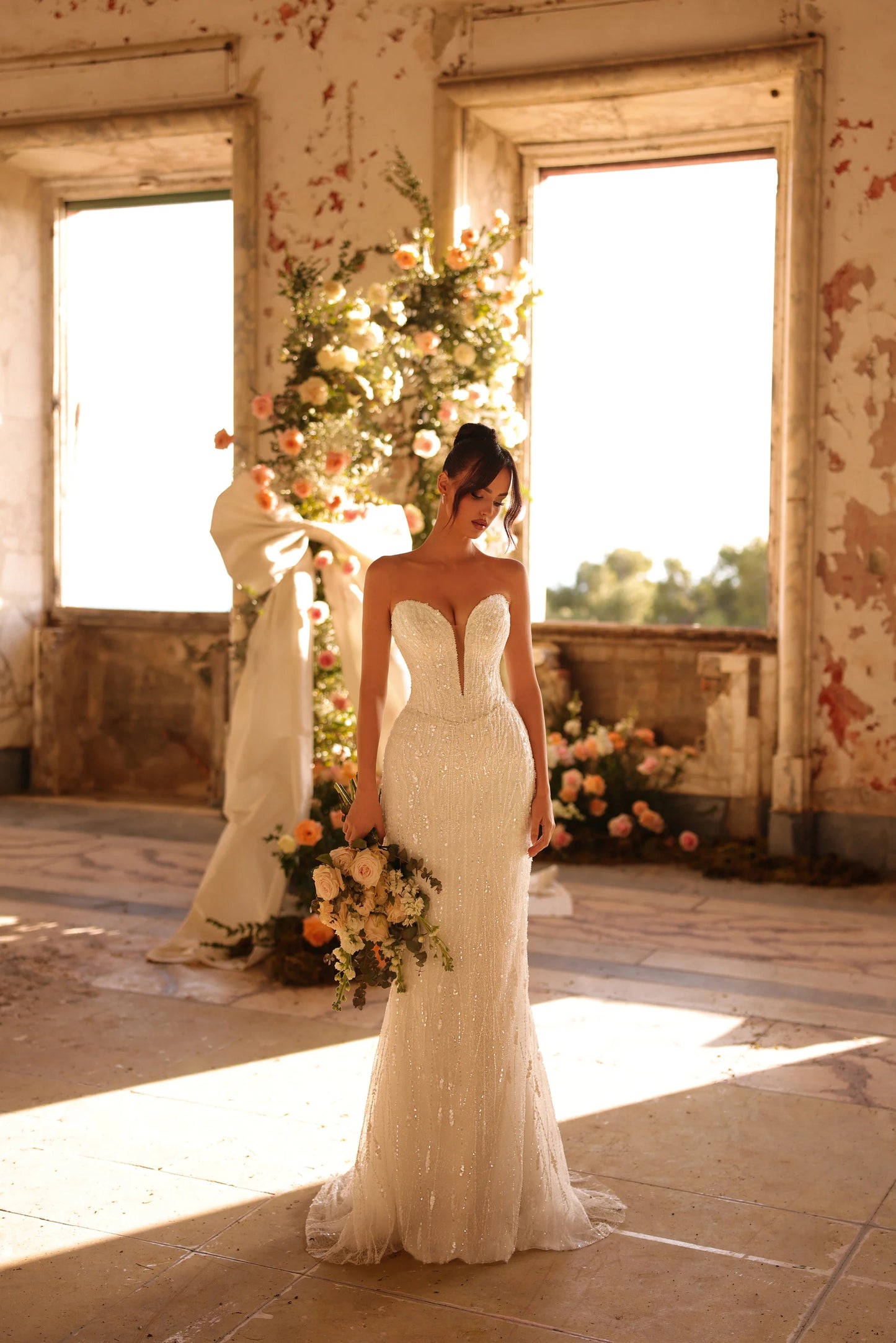 Elegant bridal gown with removable sleeves and sparkling details