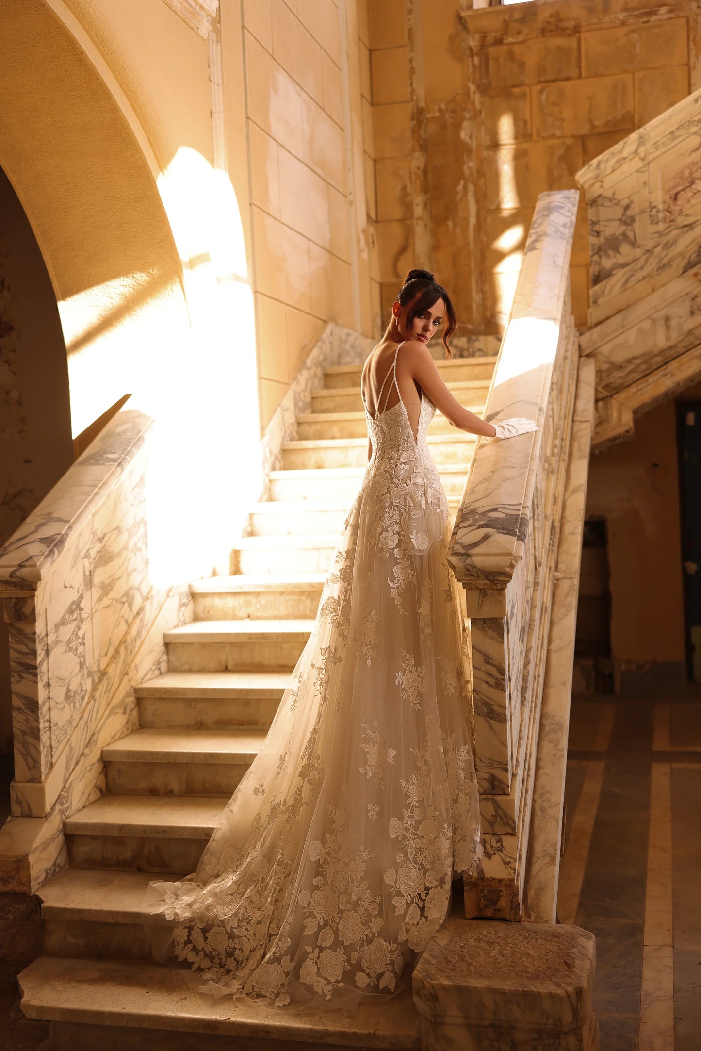 Side view of the dress showing train and soft flowing tulle.