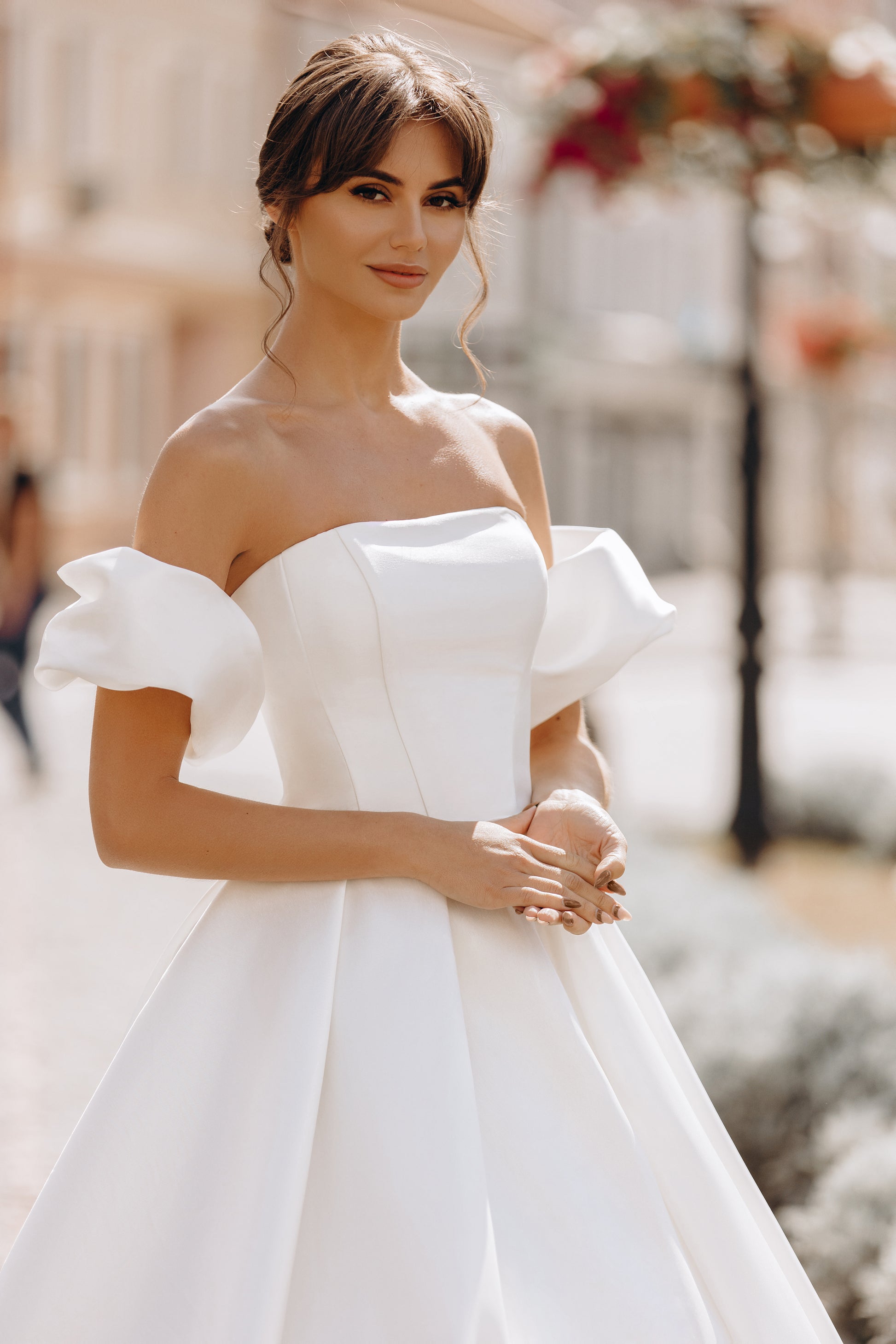 Ball gown with fitted bodice, puff sleeves, and flowing skirt