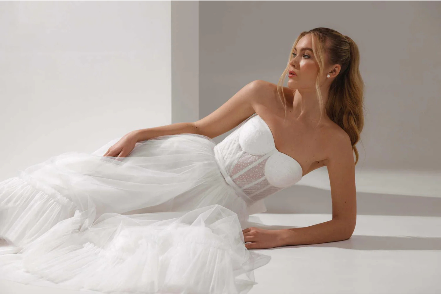 Short A-line bridal dress with strapless corset and soft volume