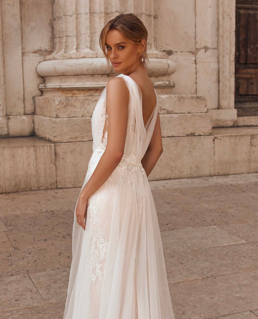 Delicate floral details on gown bodice with soft, flowy skirt