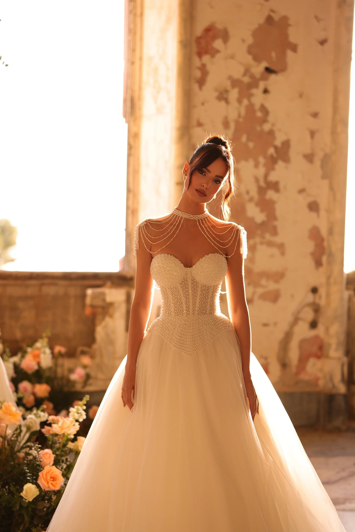 Elegant wedding gown with a full skirt and royal-inspired silhouette