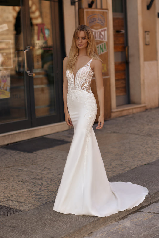 Bride in mermaid ivory gown with floral embroidery and sleek silhouette