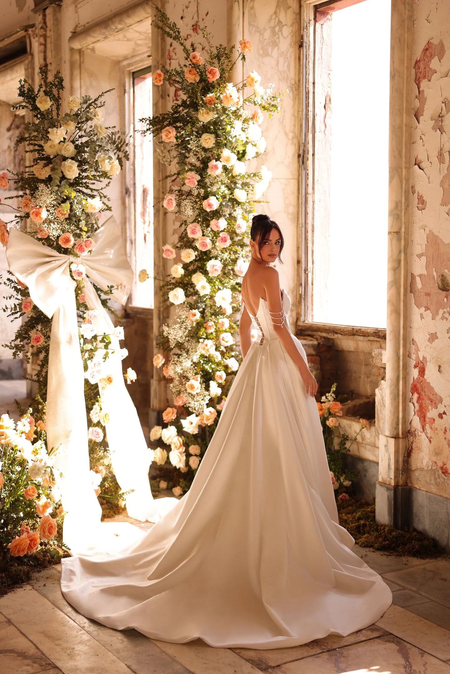 Elegant minimalist wedding gown with bold slit and structured silhouette
