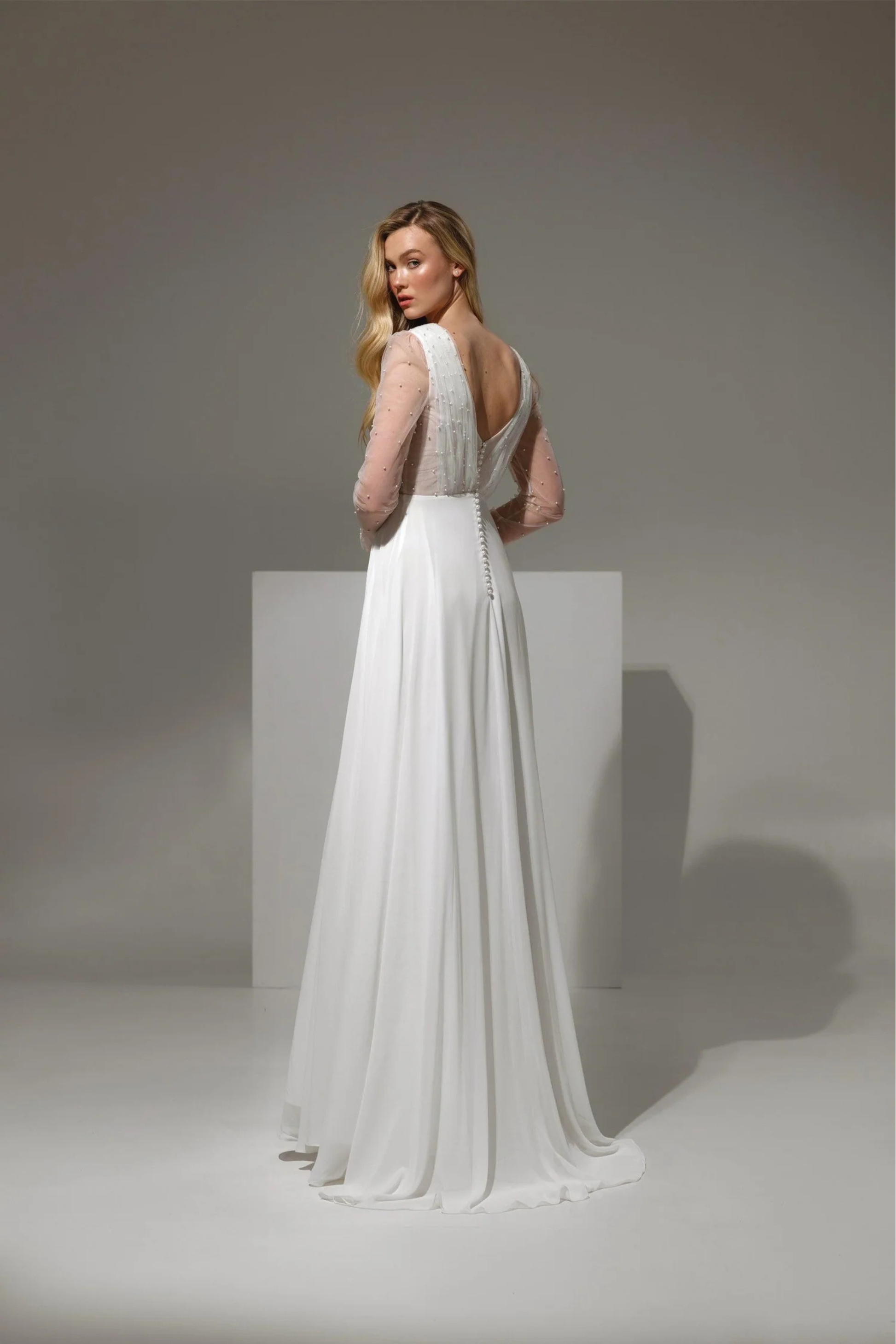 Romantic bridal gown with deep V neckline