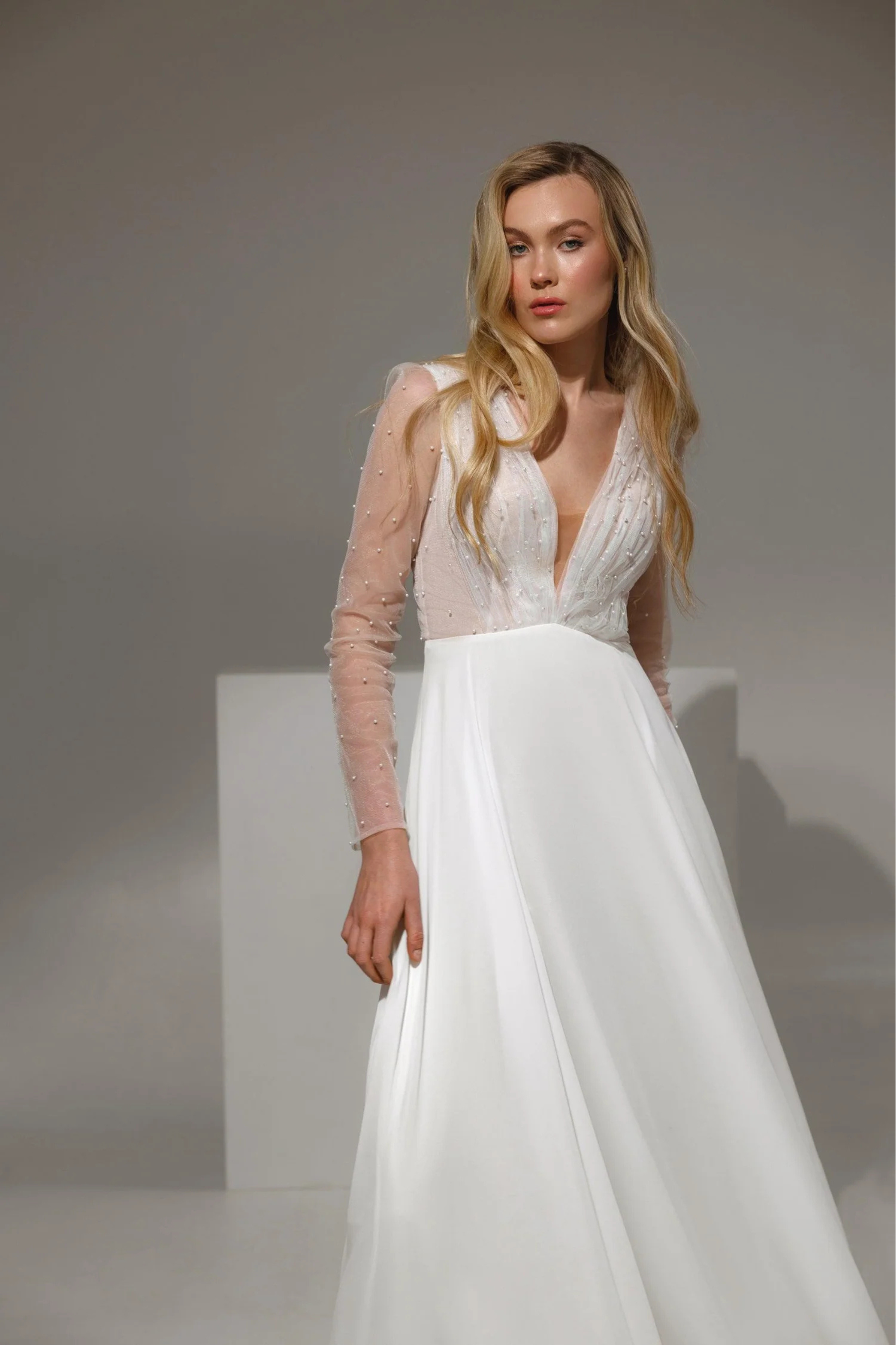 Elegant long sleeve wedding dress with bead detailing