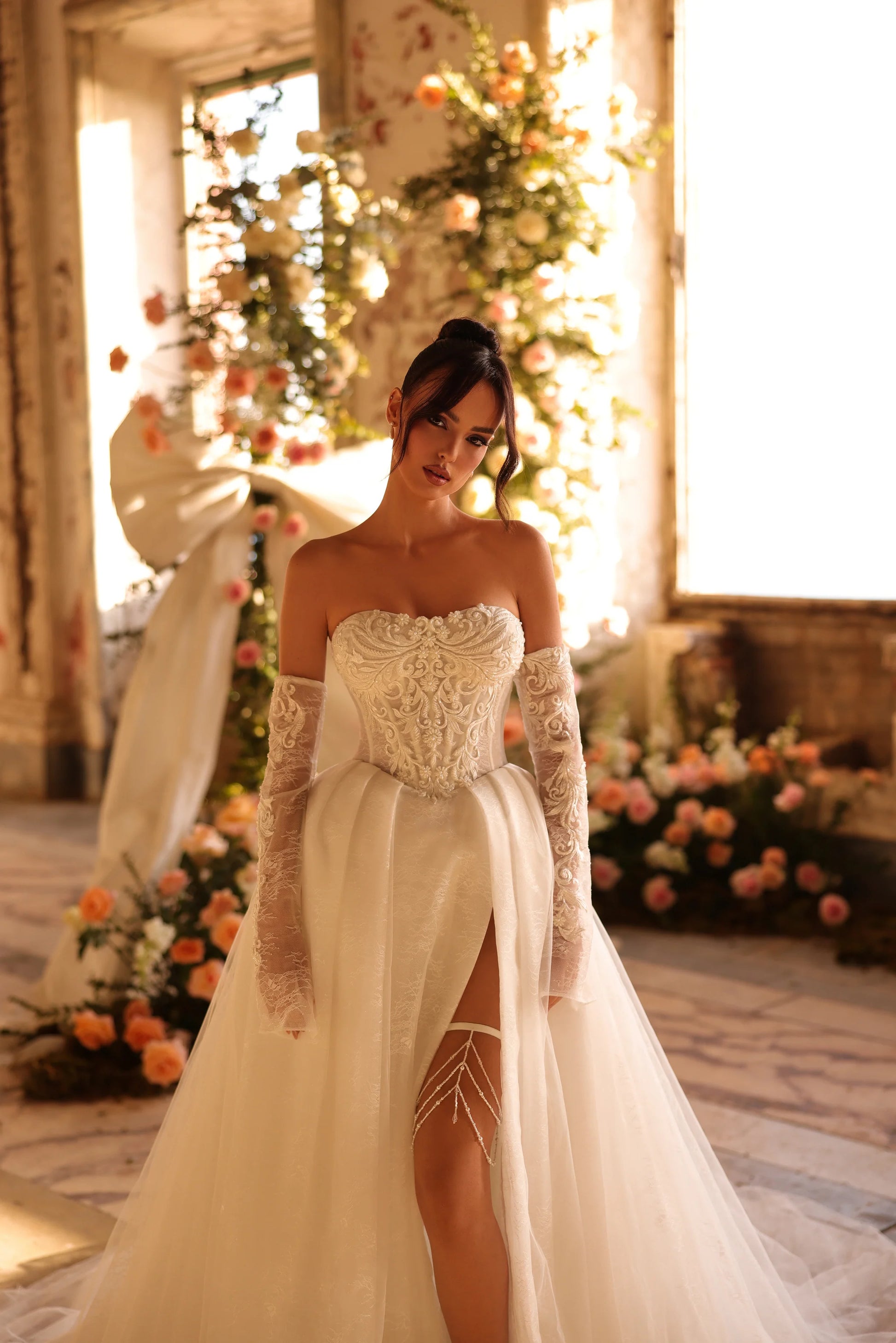 Romantic bridal dress with pearl garter and intricate bodice details