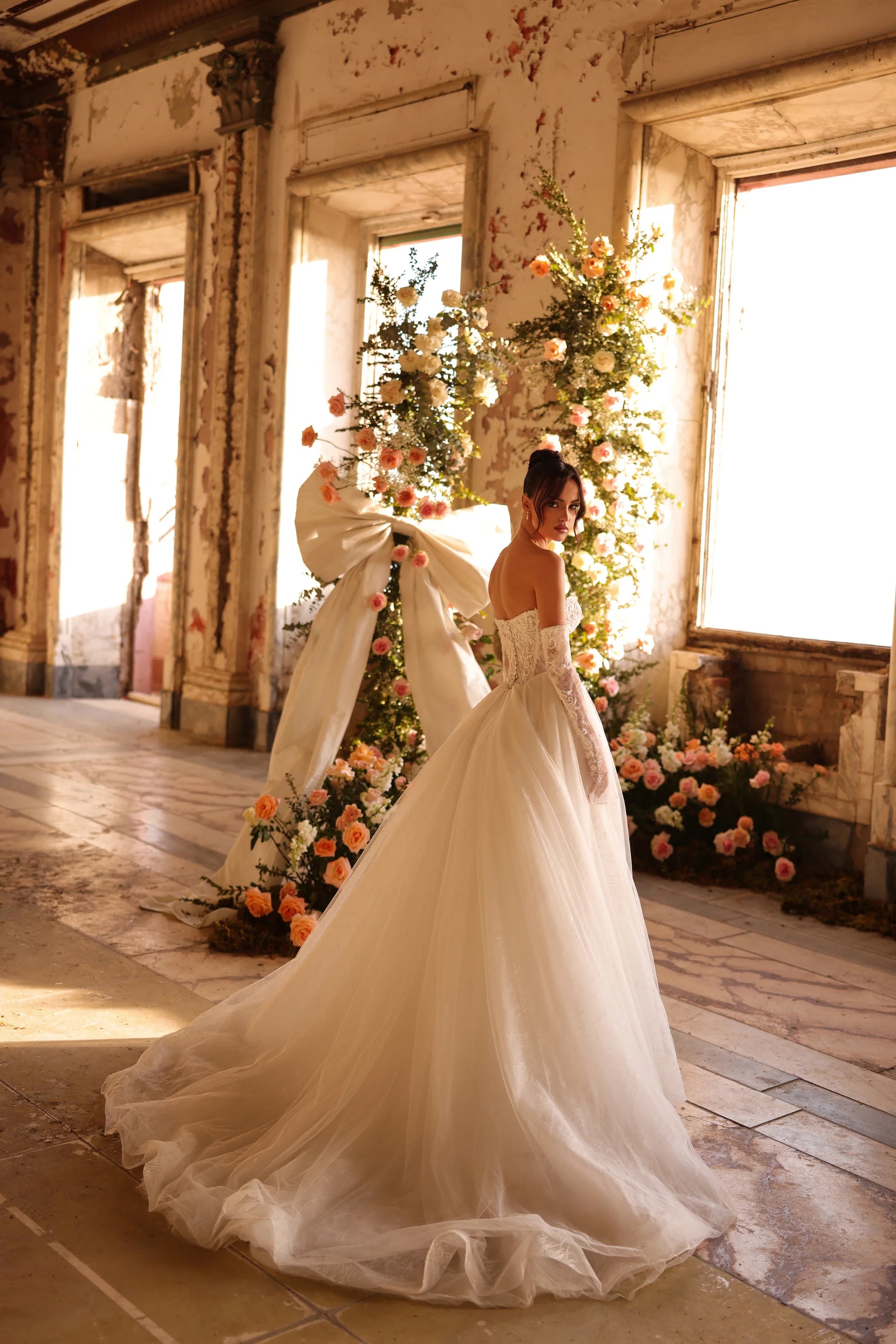 Flowing wedding gown with dramatic train and regal silhouette