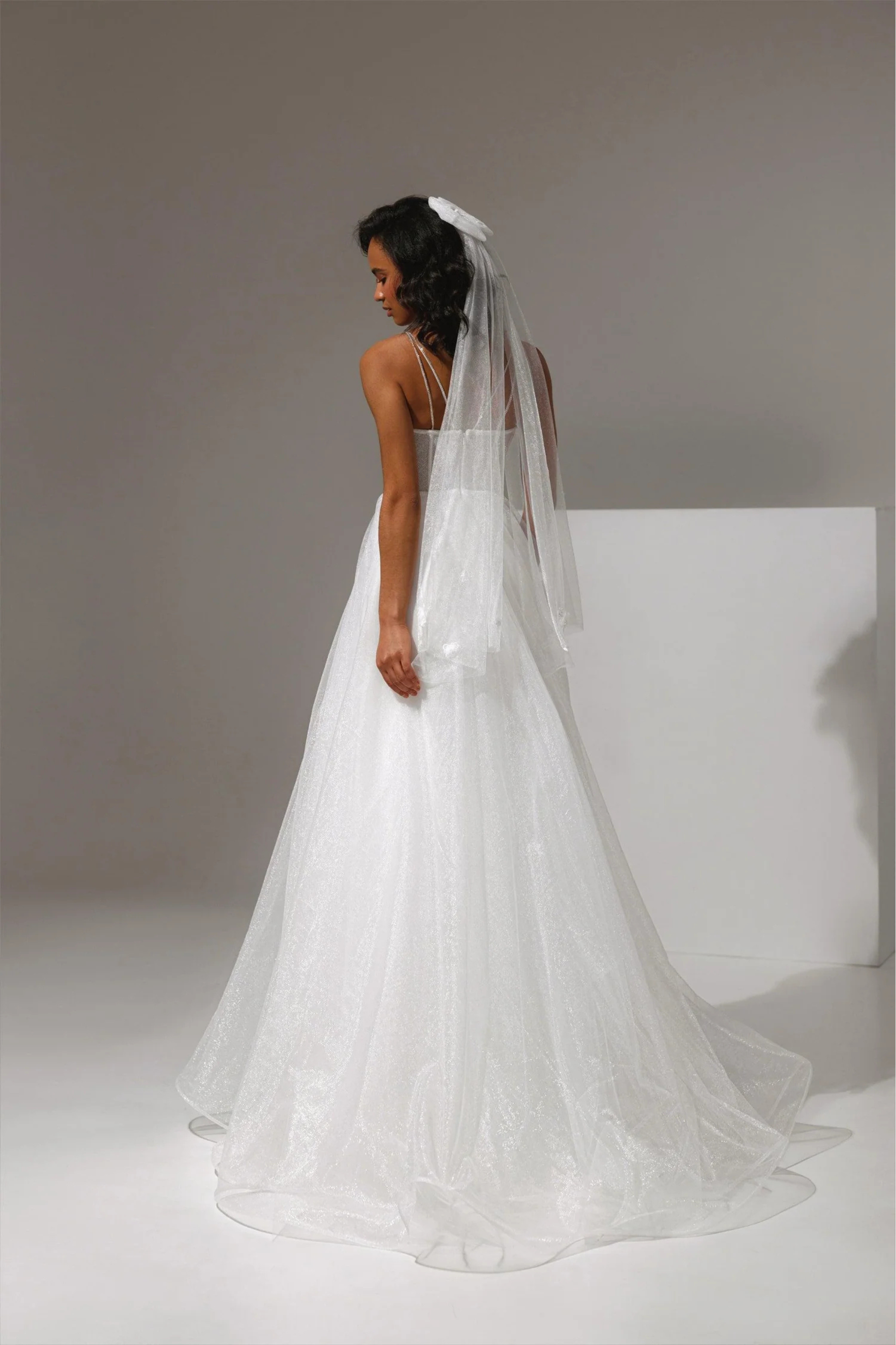 vory bridal gown with lace appliqués and thin straps