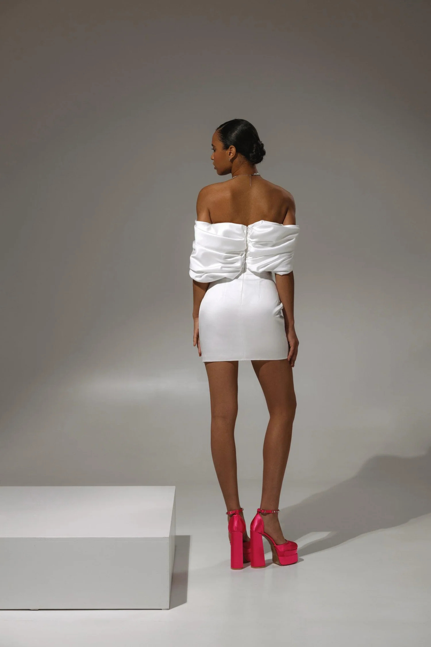 Ivory satin bridal mini dress with structured fit and clean silhouette