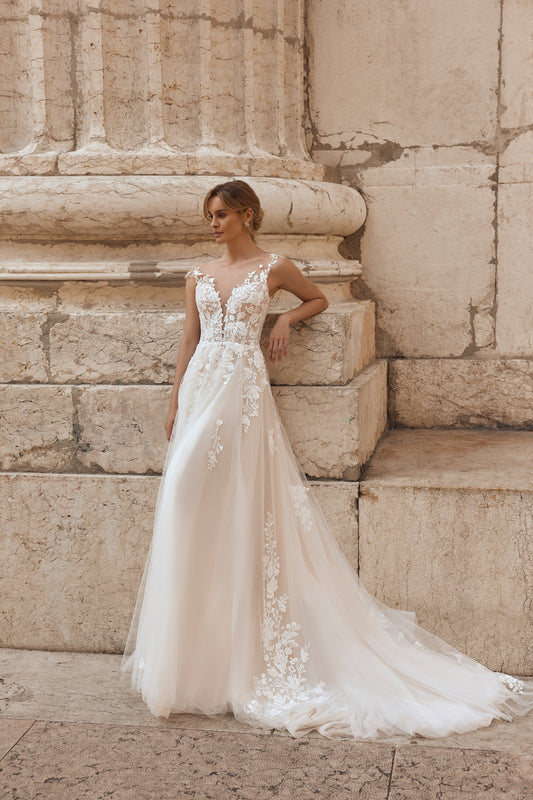 Intricate floral lace detail on top with soft layers of voluminous tulle