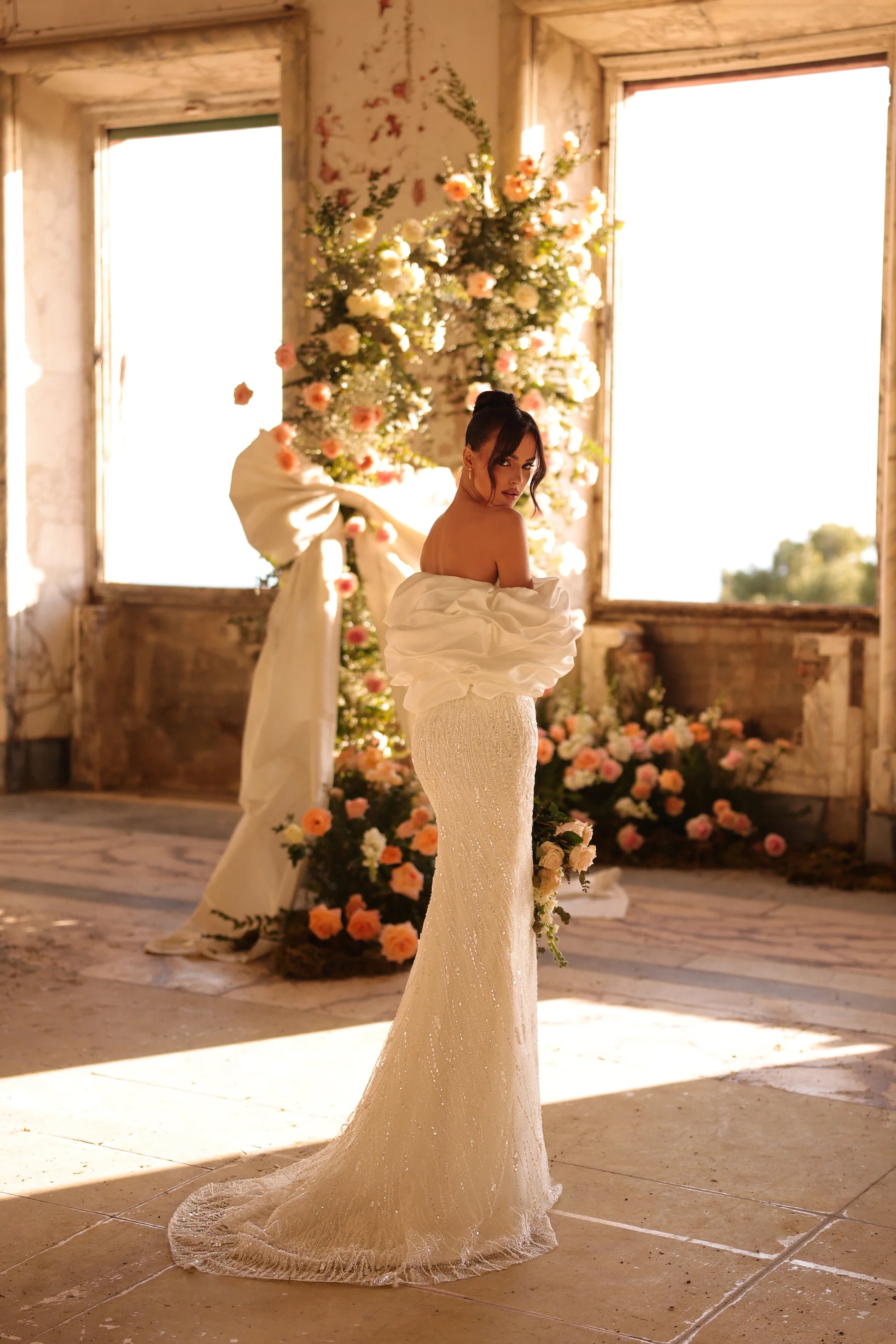 Wedding dress with soft shimmer and romantic silhouette in floral setting