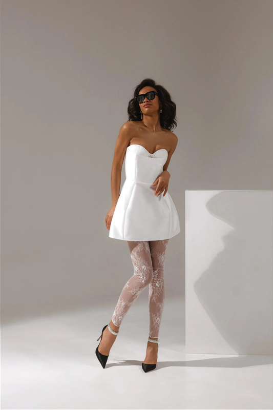 Short wedding dress styled with lace tights and modern bridal look